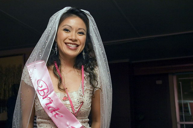 Sharon on the night before her wedding in bride sash and veil