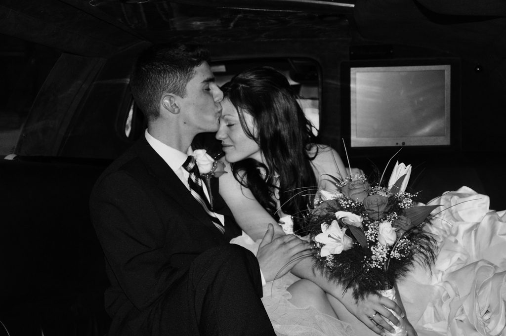 Couple Kissing inside Limousine