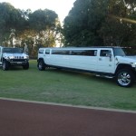 Matching White Hummer limousines
