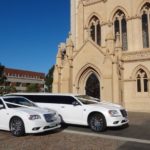 two wedding limos parked in front of a church in Mandurah